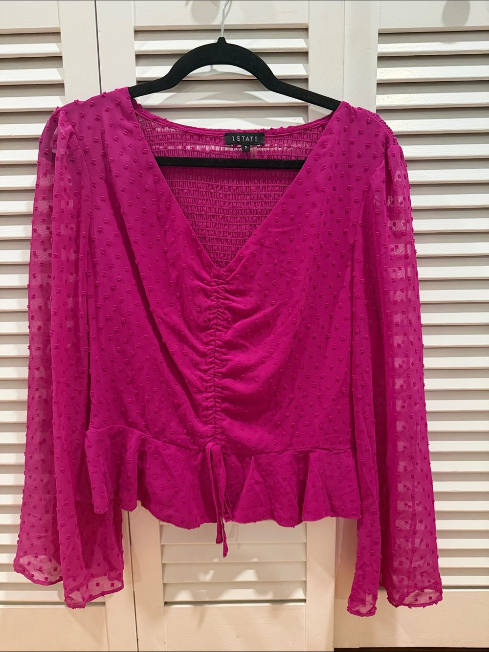 1. State Magenta Ruched V-Neck Swiss Dot Peplum Blouse